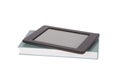Ebook reader tablet with blankscreen on top of a paper book. Iso Royalty Free Stock Photo