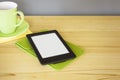 Ebook reader on a wooden table
