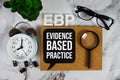 EBP - Evidence Based Practice acronym with alarm clock and magnifying glass, business concept background Royalty Free Stock Photo
