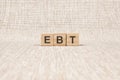 EBT word written on wood blocks. text on brown backgrond for your desing, concept Royalty Free Stock Photo