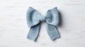Eccentric Dutch Tradition: Blue Crochet Bow On Wooden Surface