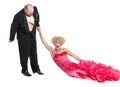 Eccentric Fat Man Dragging a Woman by the Hand Lying on Floor Royalty Free Stock Photo