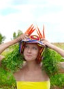 Eccentric woman with fresh carrot