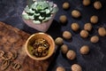 Echeveria plant and walnuts on blue slate table. Healthy nuts and seeds composition. Royalty Free Stock Photo