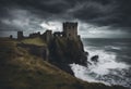 Echoes of Majesty: Ruined Castle on a Cliff Overlooking the Sea with Crashing Waves