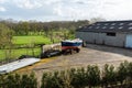 Echt, Limburg, The Netherlands, Barn with tractor pulling a boat