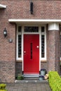 Echt, Limburg, The Netherlands - Red door of a regular residential house in the row