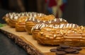 Eclair cakes on a wooden cutting board Royalty Free Stock Photo