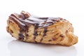 Eclair with cream in chocolate coating