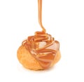 Eclair poured with liquid caramel Royalty Free Stock Photo