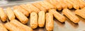 Eclairs on a baking sheet. Selective focus. Royalty Free Stock Photo