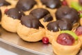 Eclairs with chocolate toppings