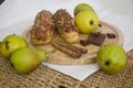 Eclairs with cinnamon and fruits Royalty Free Stock Photo