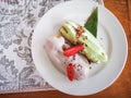 Eclairs with colored glaze on a white plate. Homemade eclairs cakes. Traditional eclairs, classics professional, eclairs french.