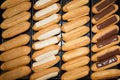 Eclairs with glaze on a white wooden table Royalty Free Stock Photo