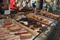 Eclairs and muffins on sale in Spitalfields Market , East London