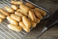 Eclairs or profiterole preparing on baking sheet. Traditional French dessert. Cooking homemade cookies, dessert