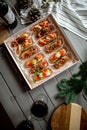 Eclairs with salmon, fresh vegetables and herbs, gourmet snacks.