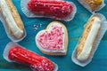 Eclairs with valentines day decor and heart shaped cookie