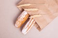 Eclairs with vanilla cream laying in craft package