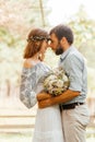 Eclectic rustic wedding couple. Intimate ceremony at backyard