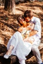 Eclectic wedding couple sitting and hugging on the bench