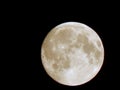 Eclipse of the moon in the night sky with a hoop of light around a close-up