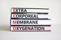 ECMO, Extra Corporeal Membrane Oxygenation symbol. Concept words `ECMO, Extra Corporeal Membrane Oxygenation` on books on a