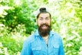 Eco activist. Go green think fresh. Protect nature eco movement. Man handsome bearded guy in sunny forest. United with Royalty Free Stock Photo