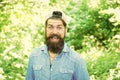 Eco activist. Go green think fresh. Protect nature eco movement. Man handsome bearded guy in sunny forest. United with Royalty Free Stock Photo