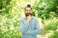 Eco activist. Man handsome bearded guy in sunny forest. United with environment. Go green think fresh. Earth day Royalty Free Stock Photo