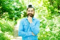 Eco activist. Man handsome bearded guy in sunny forest. United with environment. Go green think fresh. Earth day Royalty Free Stock Photo