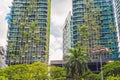 Eco architecture. Green skyscraper building with plants growing on the facade. Ecology and green living in city, urban environment Royalty Free Stock Photo