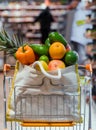 Eco bag with different fruits and vegetables. Shopping in the supermarket