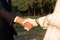 Eco-businessman handshake with farmer, eco-friendly farming. Gyre Royalty Free Stock Photo