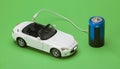 The eco car powered by batteries on green background Royalty Free Stock Photo