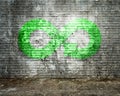 ECO, circular economy, fluorescent green infinity arrow symbol, bricks wall Royalty Free Stock Photo
