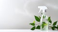 Eco cleaning spray bottle and green leaves on gray background Royalty Free Stock Photo