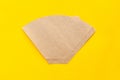 Eco coffee filter isolated on minimal light bright yellow background. Pour over method, organic zero vaste unbleached Royalty Free Stock Photo