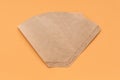 Eco coffee filter isolated on minimal pastel light beige background. Pour over method, organic zero vaste unbleached Royalty Free Stock Photo