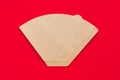 Eco coffee filter isolated on minimal red background. Pour over method, organic zero vaste unbleached paper material