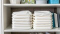 Eco-Conscious Consumer Neatly folded cloth diapers on shelf in nursery setting Royalty Free Stock Photo