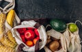 Eco cotton string mesh bag with fruits. Bananas, apples, kiwi, lime and avocado. Ecological Zero Waste Food Shopping