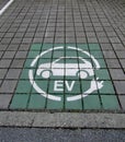 Eco electric car charging station sign painted on parking lot. Royalty Free Stock Photo