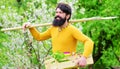 Eco farm. Gardener work. Spring farming. Bearded farmer with gardening shovel preparing to planting.