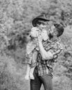 Eco farm. small boy child help father in farming. father and son in cowboy hat on ranch. kid in rubber boots. happy man Royalty Free Stock Photo