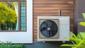 Eco-friendly air conditioning system outdoors in a modern house. Eco-housing, energy-saving houses, and earth-friendly images.