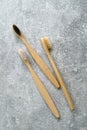 Eco-friendly bamboo toothbrushes on concrete stone background. Natural organic bathroom beauty product concept. Flat lay, top view Royalty Free Stock Photo