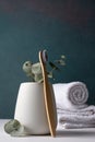 Eco-friendly bamboo toothbrushes in a white holder Royalty Free Stock Photo