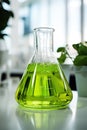 Eco-friendly biofuel contained in a laboratory flask, E-Fuel concept